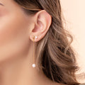 Boucles d'oreilles pendantes avec perle